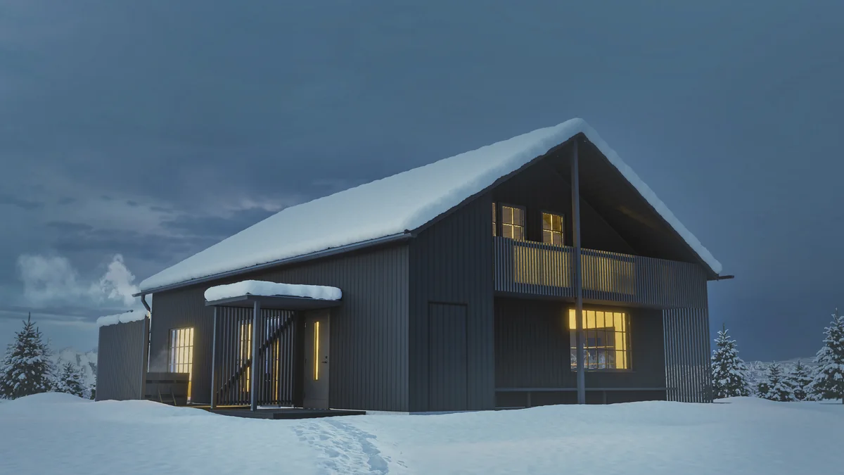 Ett mörkt fjällhus med varmt ljus i fönstren, omgivet av snö. Svartfjäll för Engbergs.